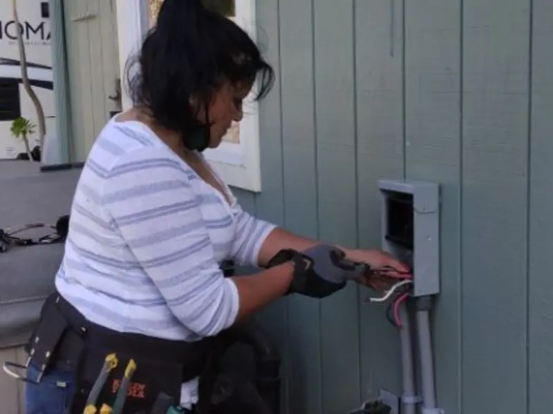 Licensed electrician wiring an exterior subpanel in Cockrell Hill